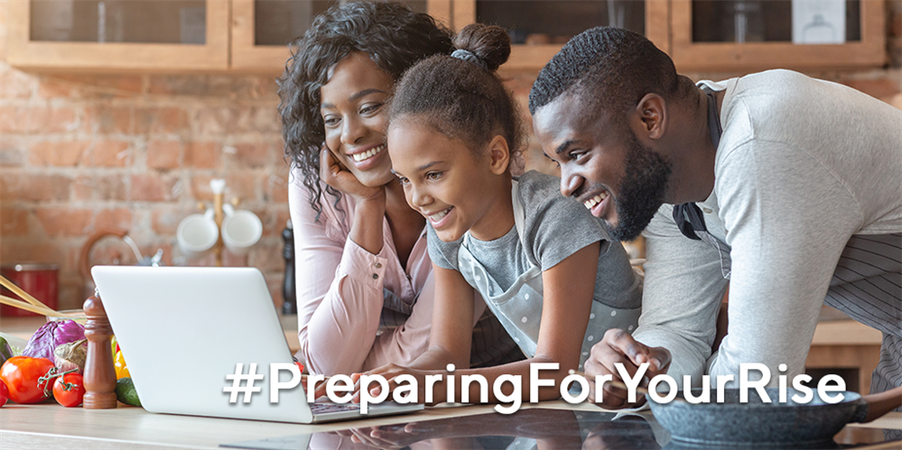  Parents with child looking at a laptop